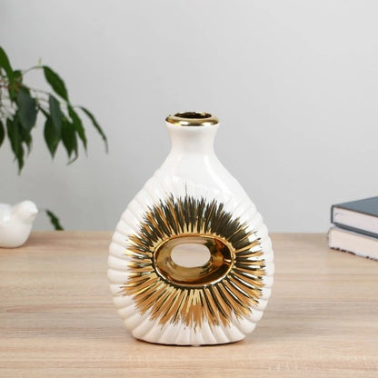 Vase décoratif blanc et or motif soleil
